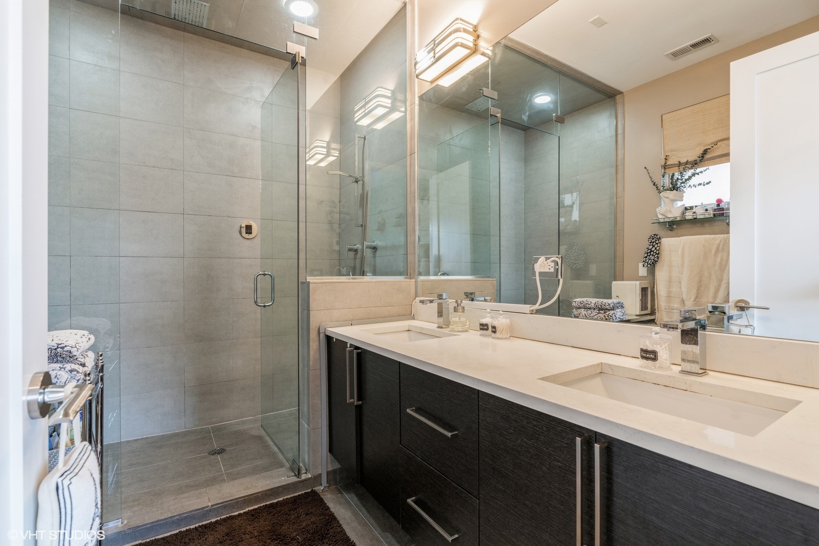 1033 South Racine Avenue, Unit 2S Chicago, IL 60607 - Photo 11 of 13 a bathroom with a double vanity sink mirror and shower