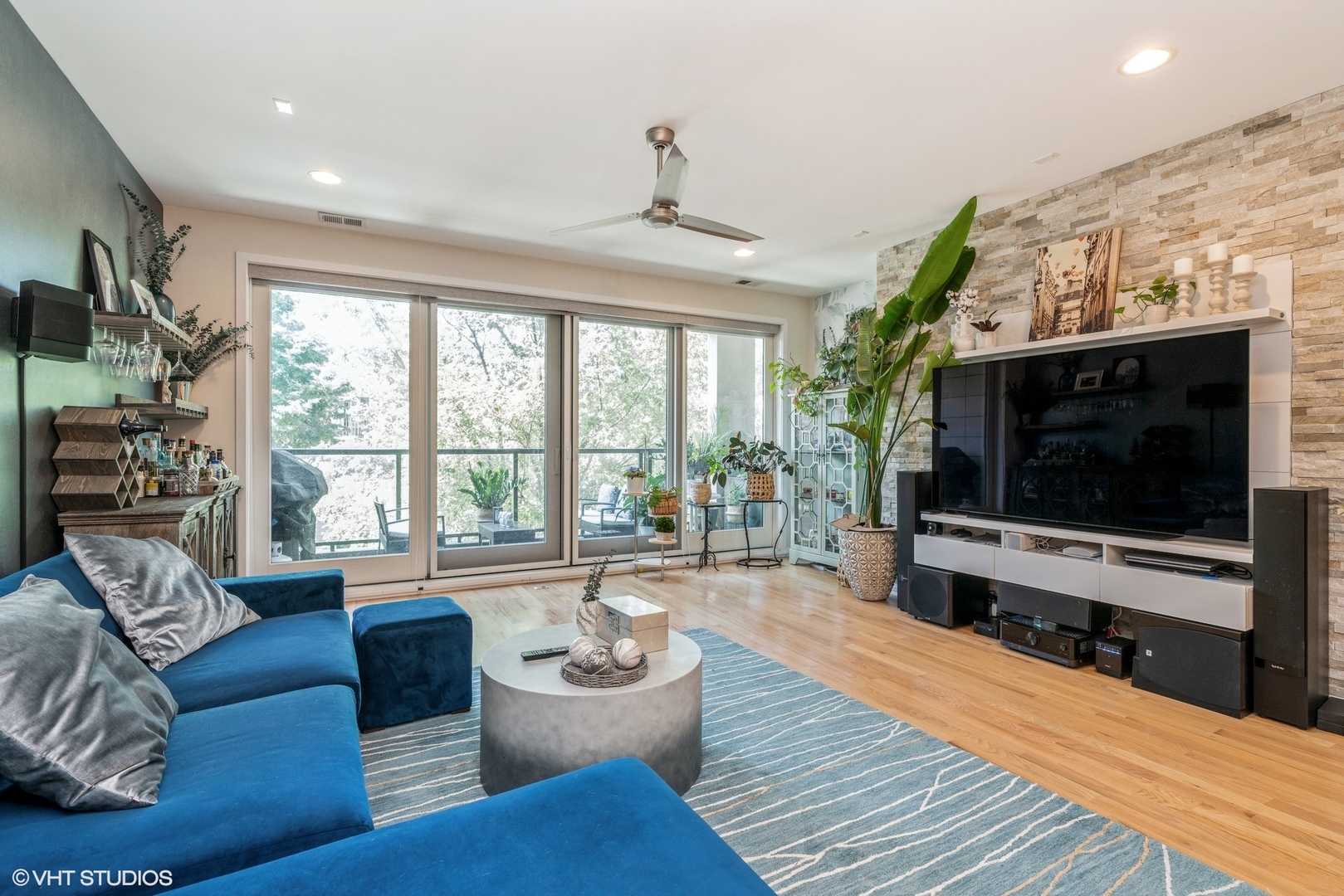 1033 South Racine Avenue, Unit 2S Chicago, IL 60607 - Photo 4 of 13 a living room with furniture and a flat screen tv