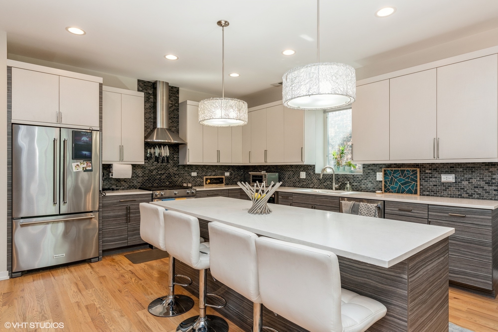 1033 South Racine Avenue, Unit 2S Chicago, IL 60607 - Photo 6 of 13 a kitchen with kitchen island a white counter top space cabinets and stainless steel appliances