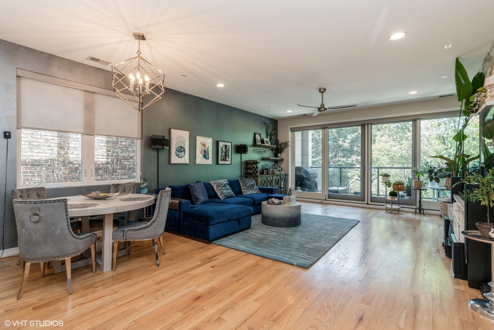 1033 South Racine Avenue, Unit 2S Chicago, IL 60607 - Photo 7 of 13 a view of a dining room with furniture a chandelier and wooden floor