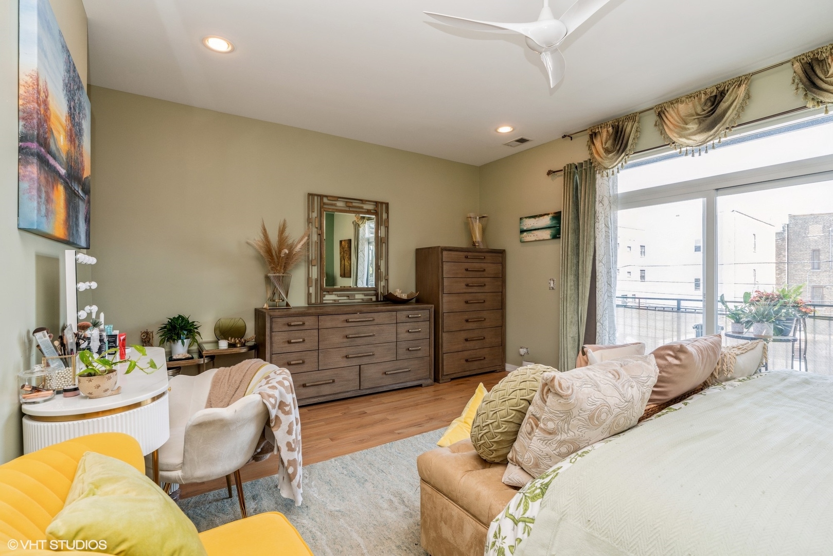 1033 South Racine Avenue, Unit 2S Chicago, IL 60607 - Photo 10 of 13 a spacious bedroom with a bed a couch and dresser