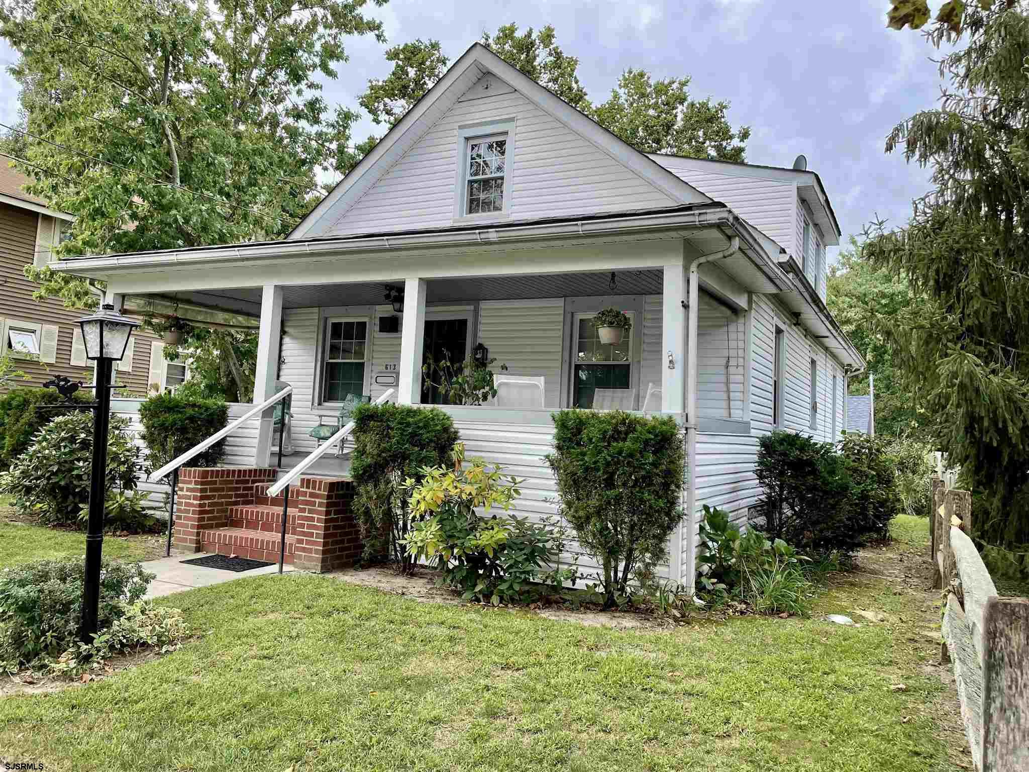 613 3rd Street Somers Point, NJ 08244 - Photo 1 of 22 a front view of a house with a yard