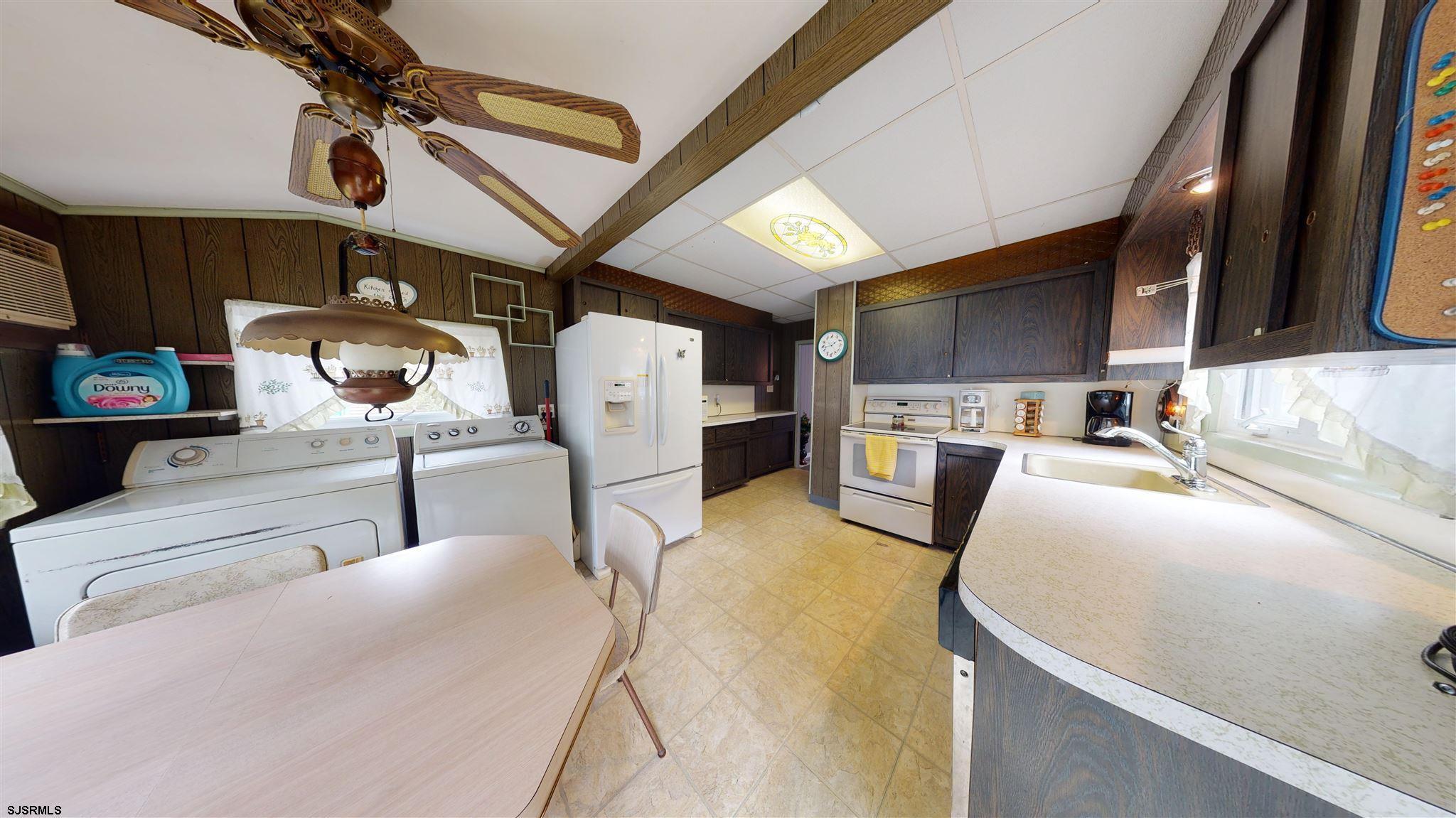 613 3rd Street Somers Point, NJ 08244 - Photo 12 of 22 a living room with furniture and a flat screen tv