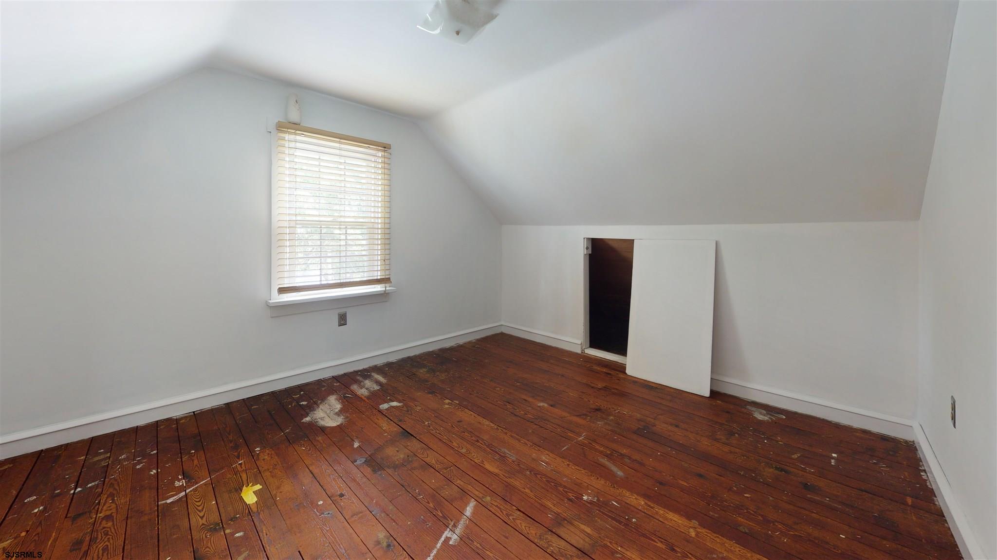 613 3rd Street Somers Point, NJ 08244 - Photo 20 of 22 an empty room with wooden floor and windows