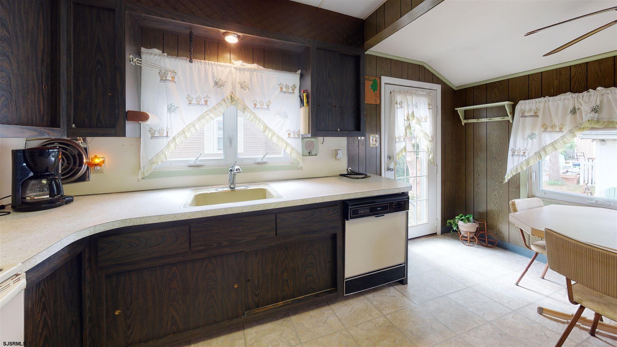 613 3rd Street Somers Point, NJ 08244 - Photo 10 of 22 a kitchen with a sink and a cabinets