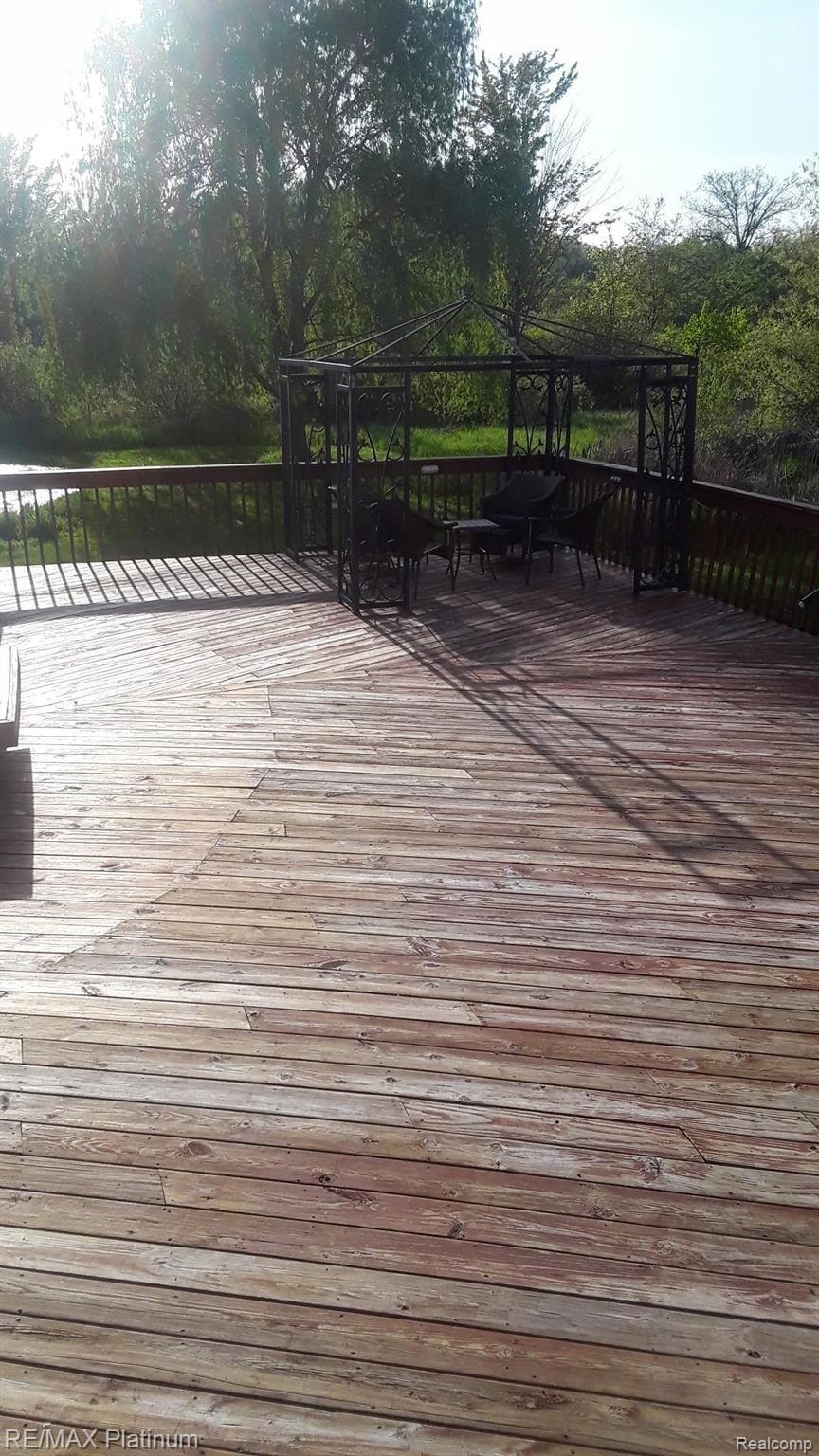 4052 Cedar Lake Road Howell, MI 48843 - Photo 30 of 34 Rear deck overlooking woods