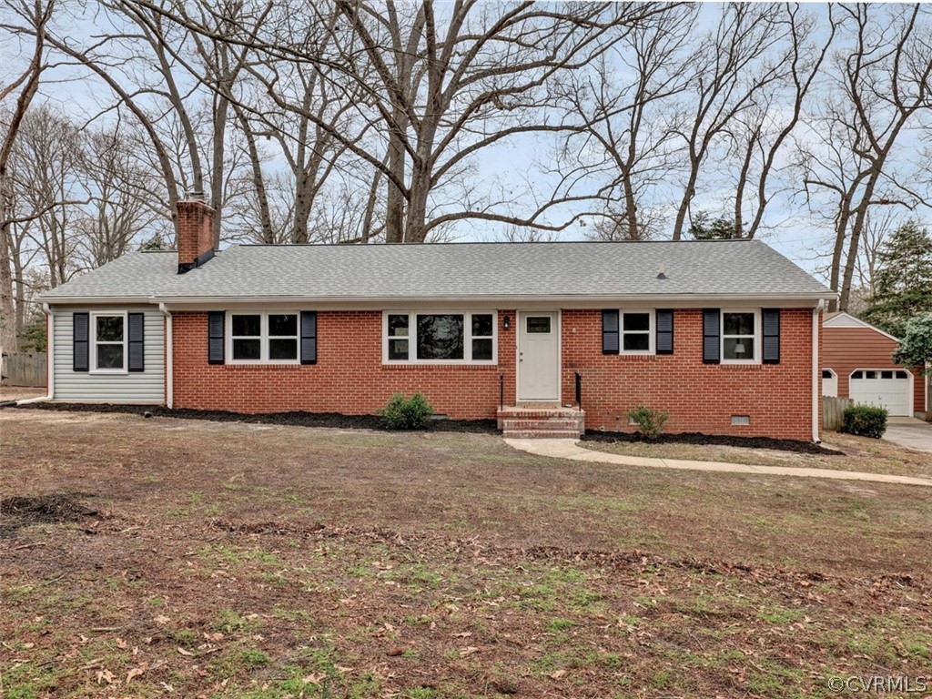 12915 Harrowgate Road Chester, VA 23831 - Photo 1 of 33 a front view of a house with a garden