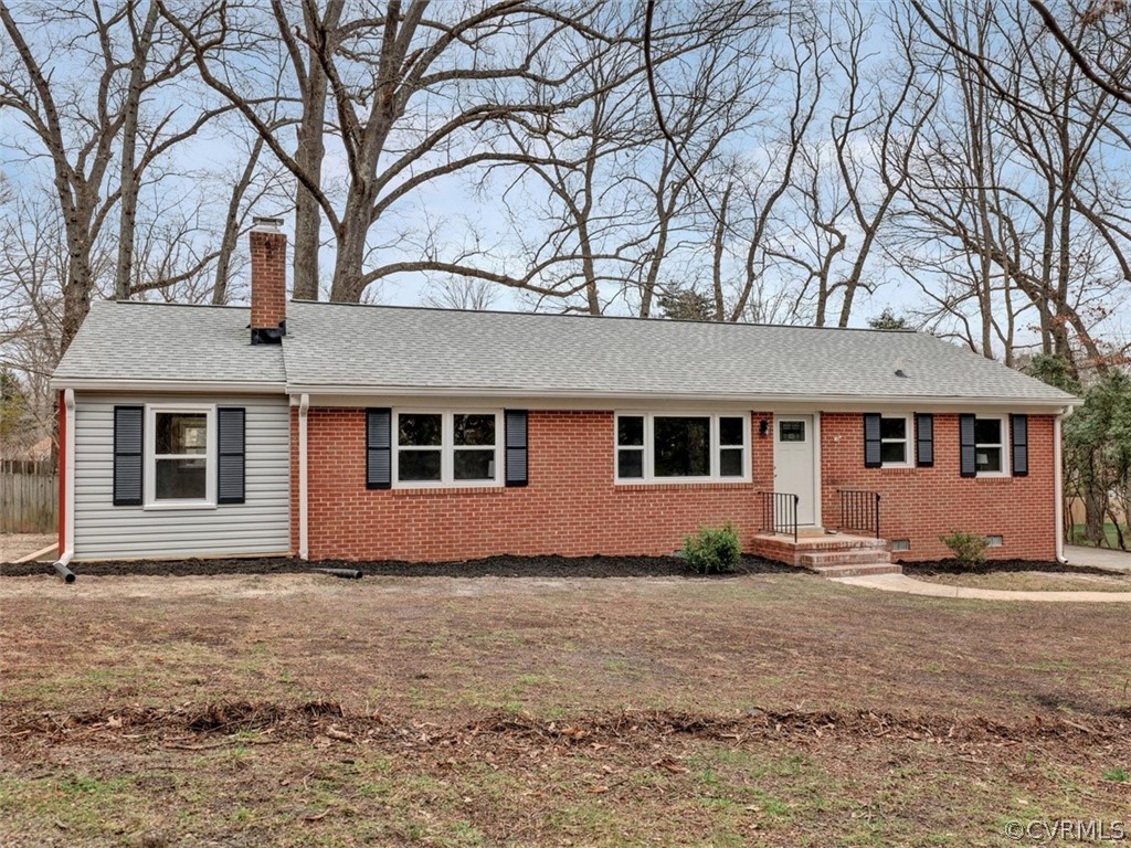 12915 Harrowgate Road Chester, VA 23831 - Photo 3 of 33 a front view of a house with a yard