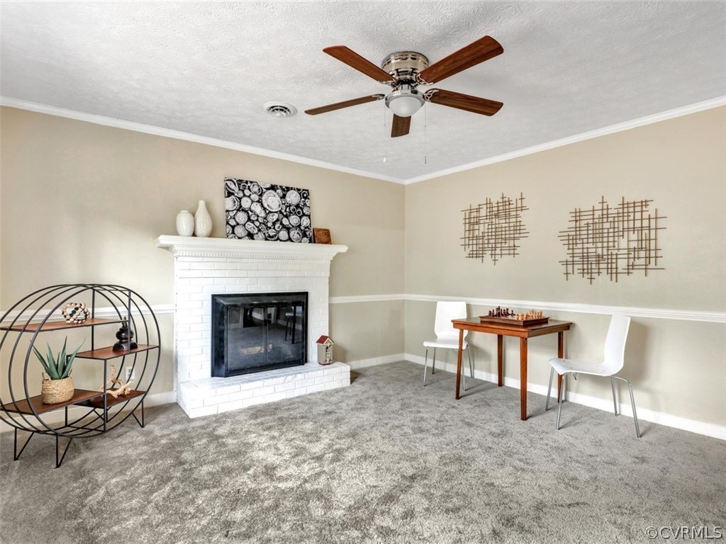 12915 Harrowgate Road Chester, VA 23831 - Photo 10 of 33 a view of a livingroom with furniture and a fireplace