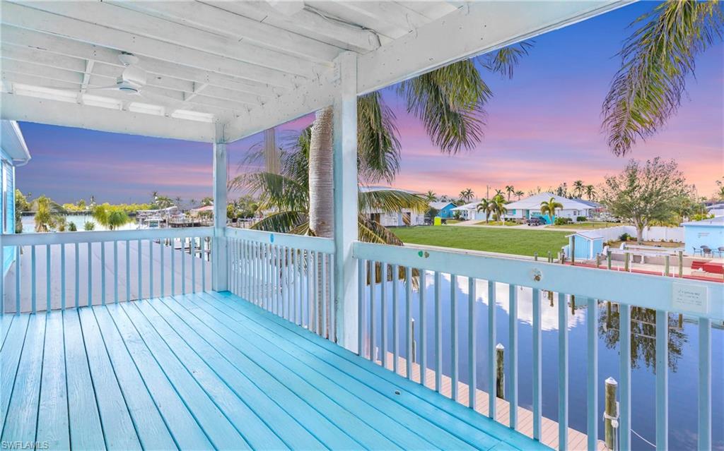12277 Boat Shell Drive Matlacha Isles, FL 33991 - Photo 22 of 46 a view of a porch with wooden floor