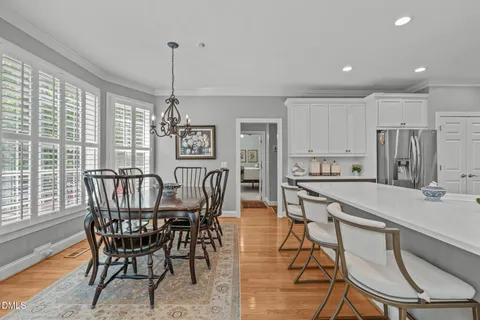 a bathroom with a sink and mirror with toilet