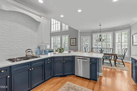 a bedroom with a bed dresser and a window