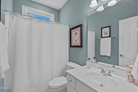 an aerial view of a house with a yard and plants