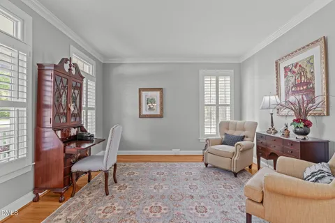 a bathroom with a granite countertop sink a toilet and a mirror
