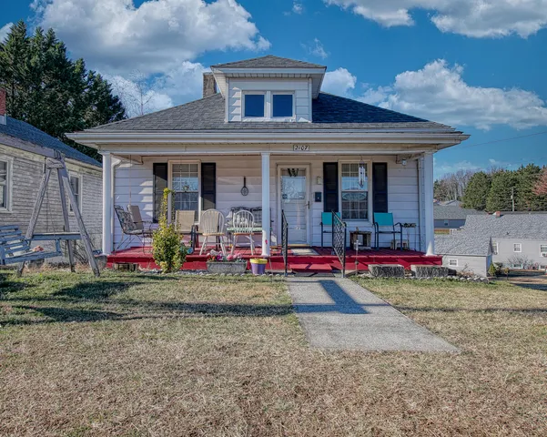 a view of a small white house