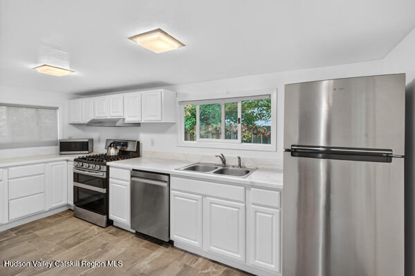 444 West Saugerties Road Saugerties, NY 12477 - Photo 11 of 20 a kitchen with a refrigerator sink and cabinets
