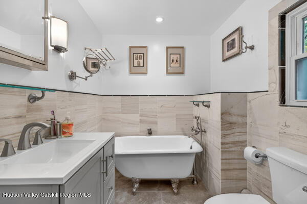 444 West Saugerties Road Saugerties, NY 12477 - Photo 13 of 20 a bathroom with a sink a toilet and a mirror