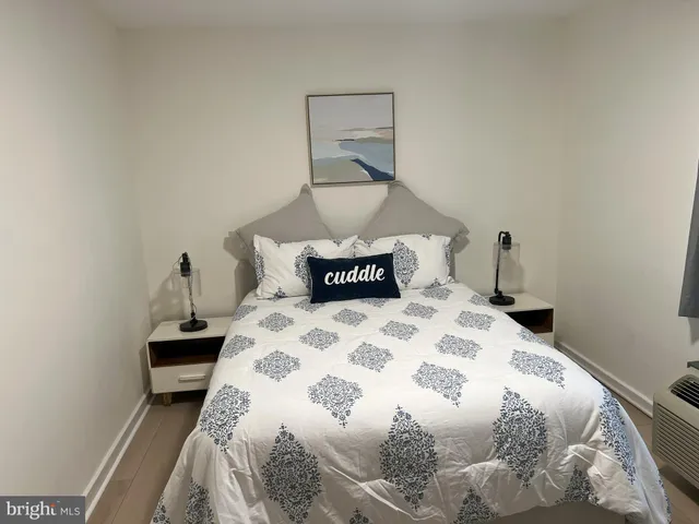 a bedroom with a bed and a table