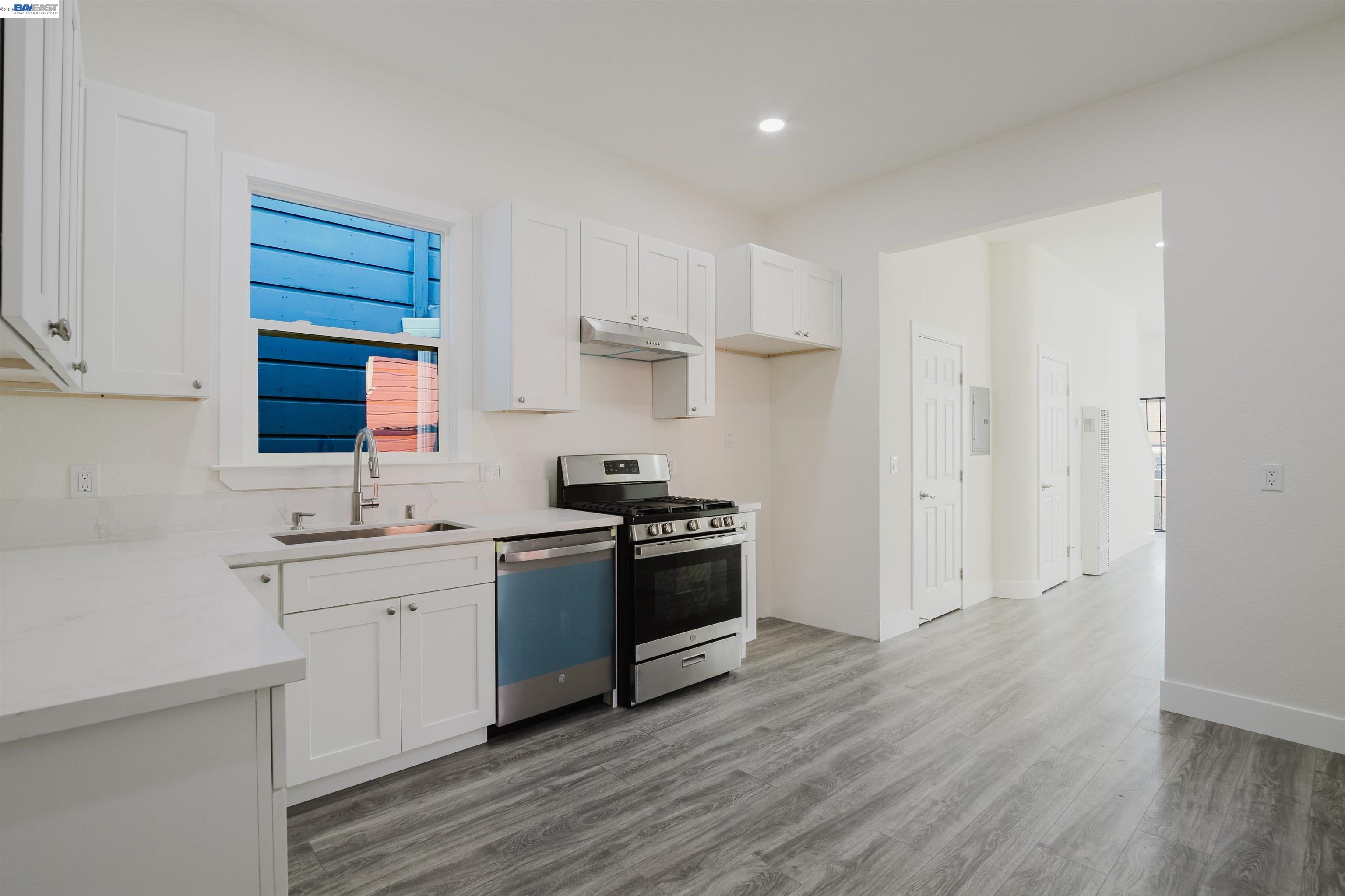 1778 8th Street Oakland, CA 94607 - Photo 5 of 36 a kitchen with a sink cabinets and stainless steel appliances