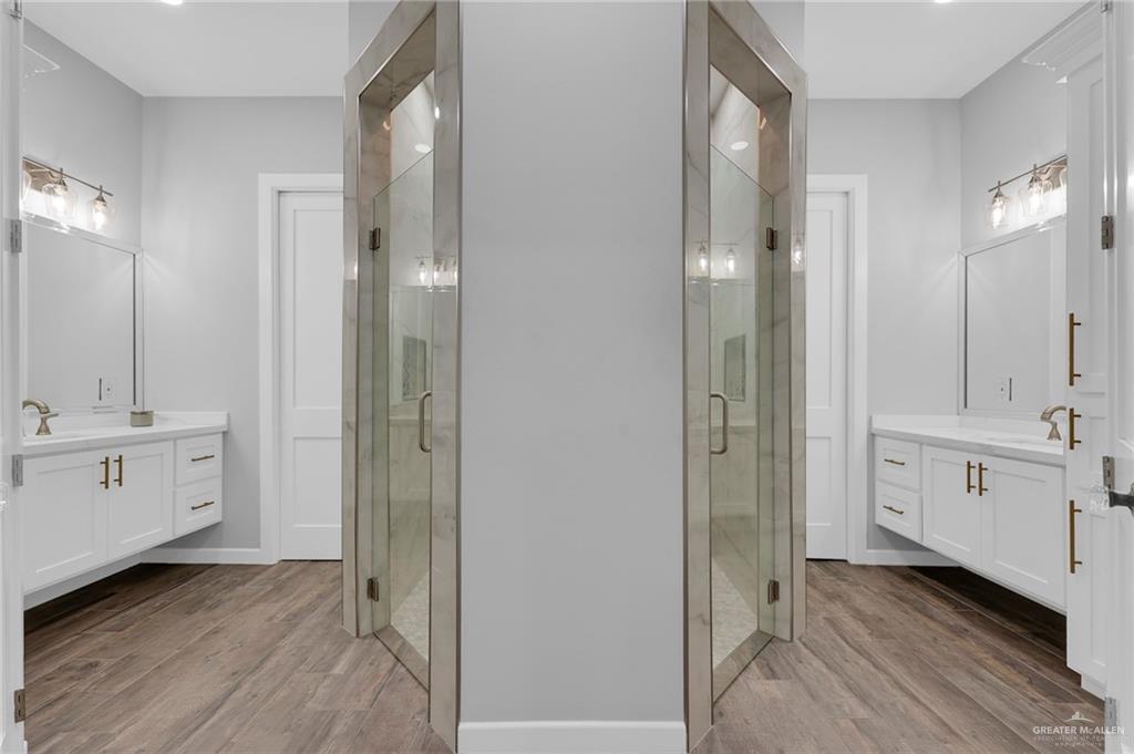 5284 North Mayberry Road Palmhurst, TX 78573 - Photo 19 of 26 a bathroom with a double vanity sink and mirror