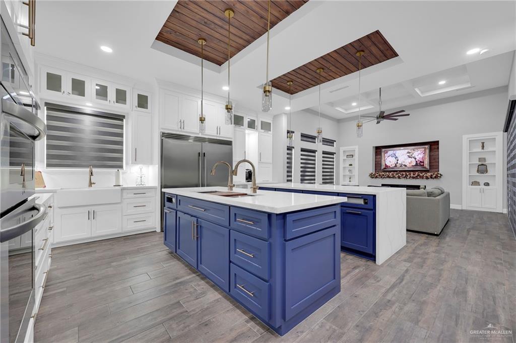 5284 North Mayberry Road Palmhurst, TX 78573 - Photo 4 of 26 a kitchen with stainless steel appliances granite countertop a stove a sink dishwasher and a refrigerator