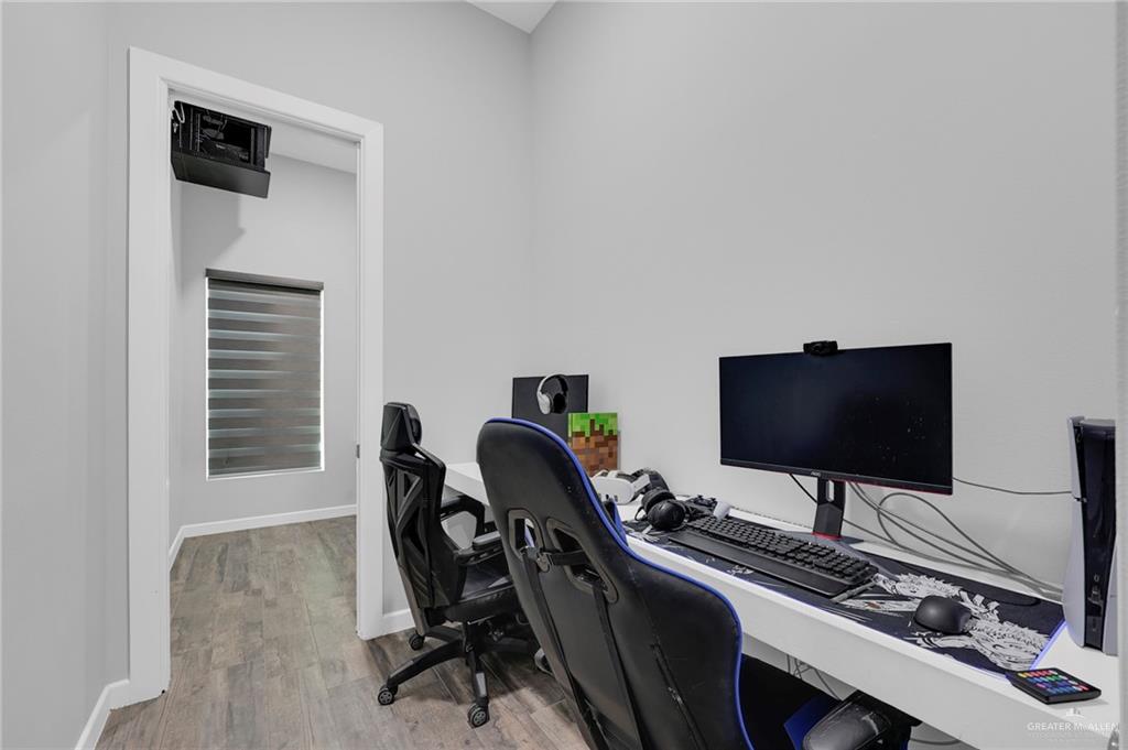 5284 North Mayberry Road Palmhurst, TX 78573 - Photo 9 of 26 a view of a workspace with furniture and a window