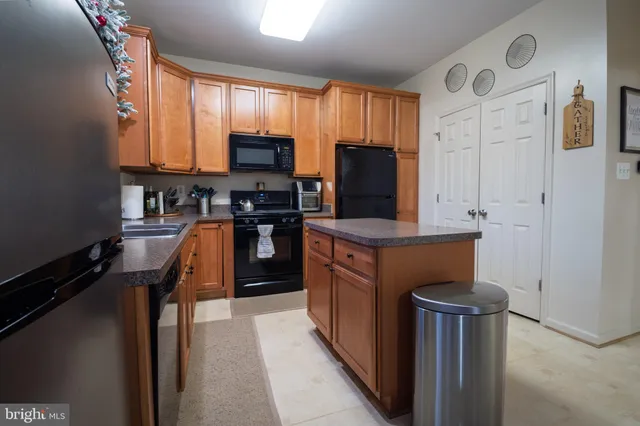 a view of staircase with railing and white walls