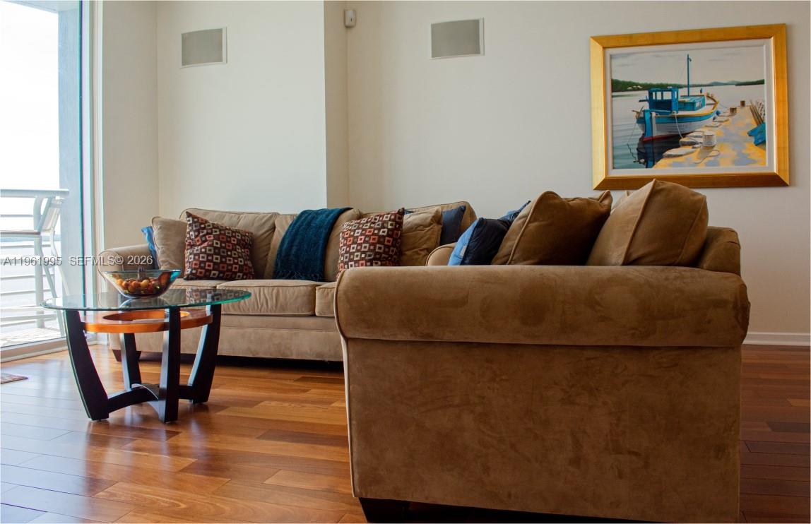 335 South Biscayne Boulevard, Unit 2212 Miami, FL 33131 - Photo 17 of 69 a living room with furniture and a painting on the wall