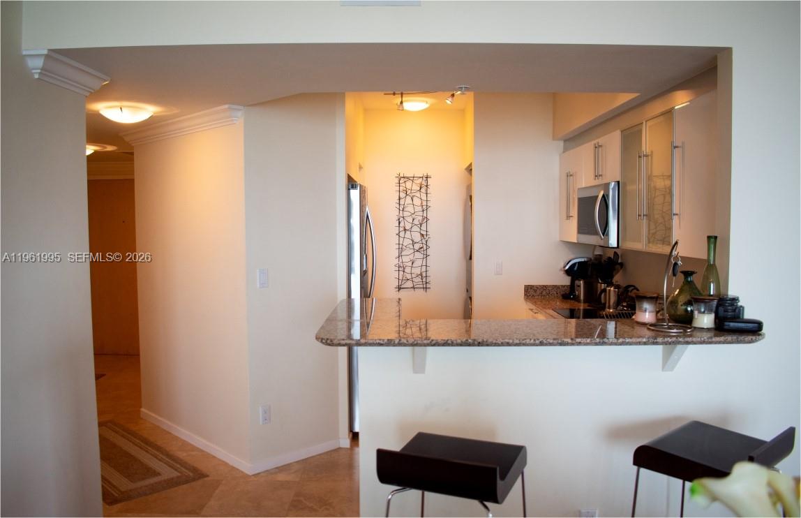335 South Biscayne Boulevard, Unit 2212 Miami, FL 33131 - Photo 19 of 69 a bathroom with a sink a mirror and a window