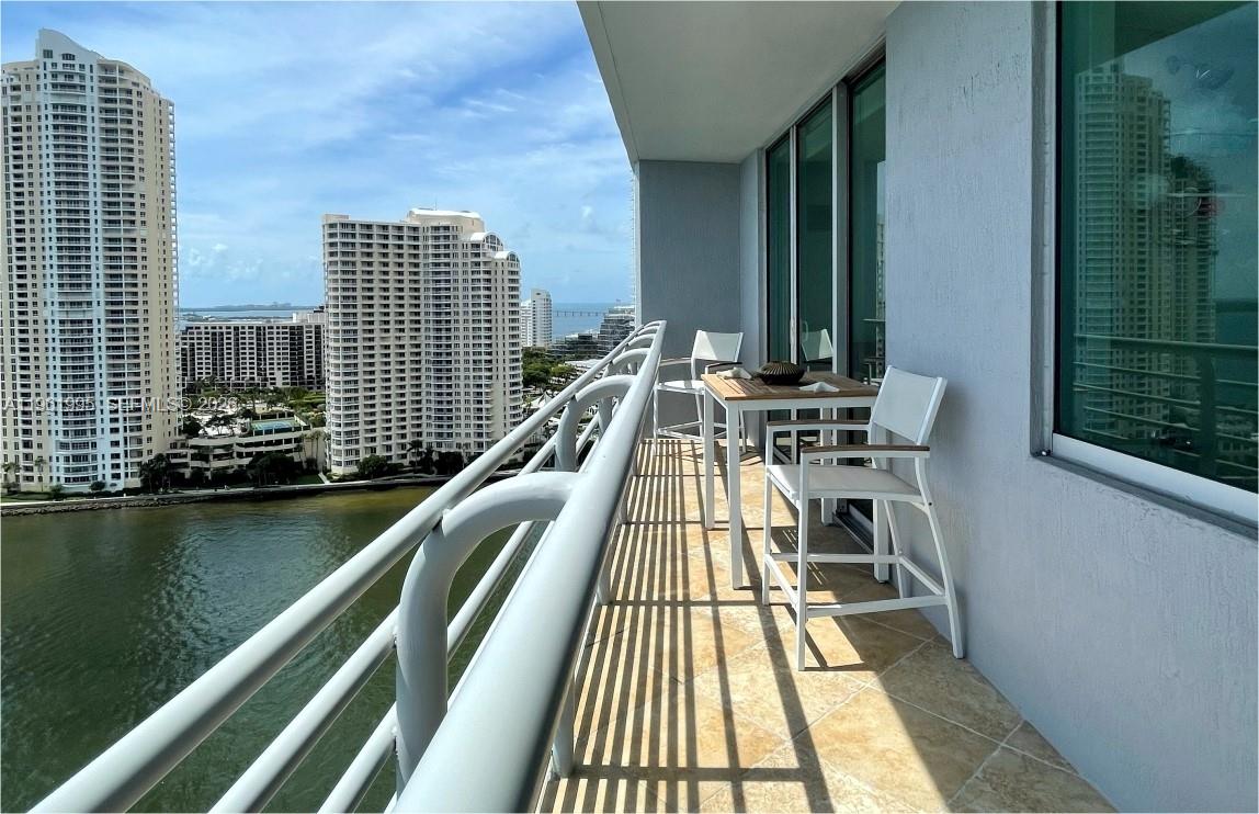 335 South Biscayne Boulevard, Unit 2212 Miami, FL 33131 - Photo 2 of 69 a view of balcony with two chairs and a table