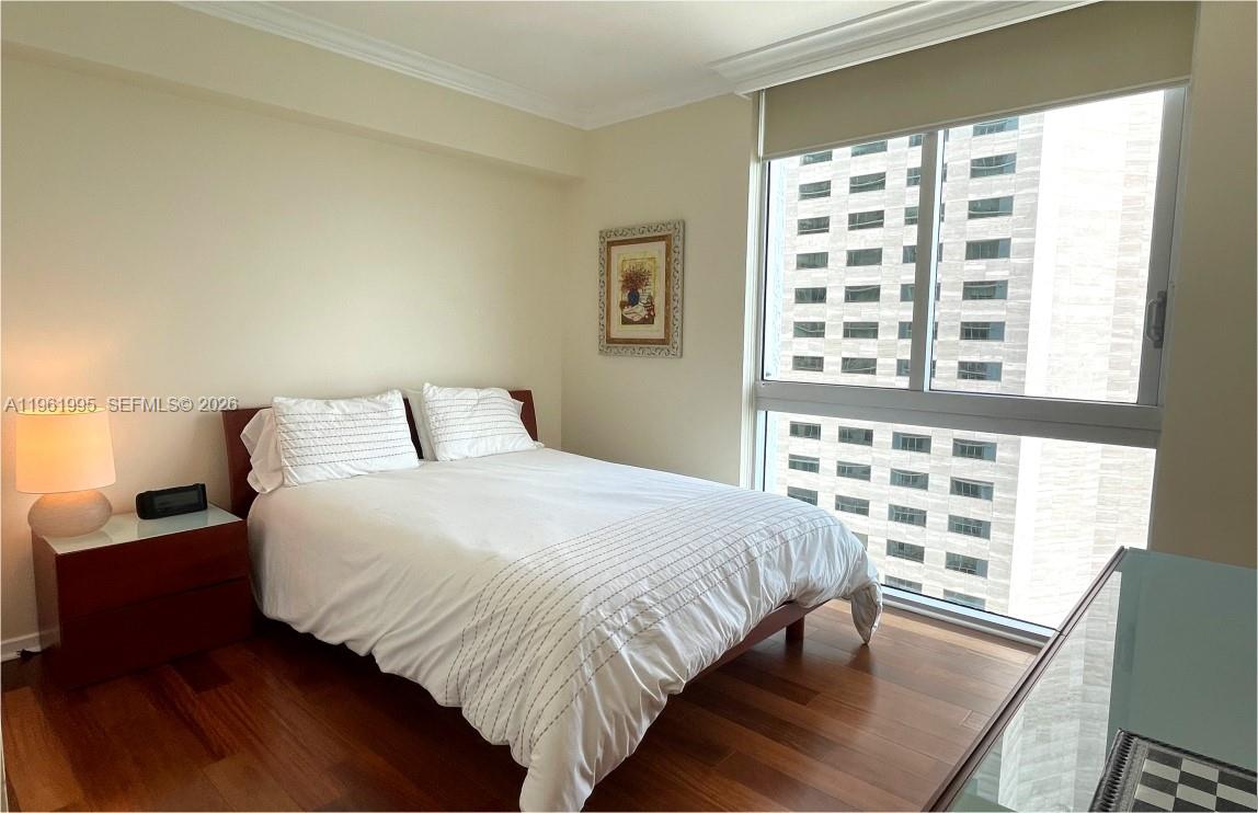 335 South Biscayne Boulevard, Unit 2212 Miami, FL 33131 - Photo 28 of 69 a bedroom with a bed and a window