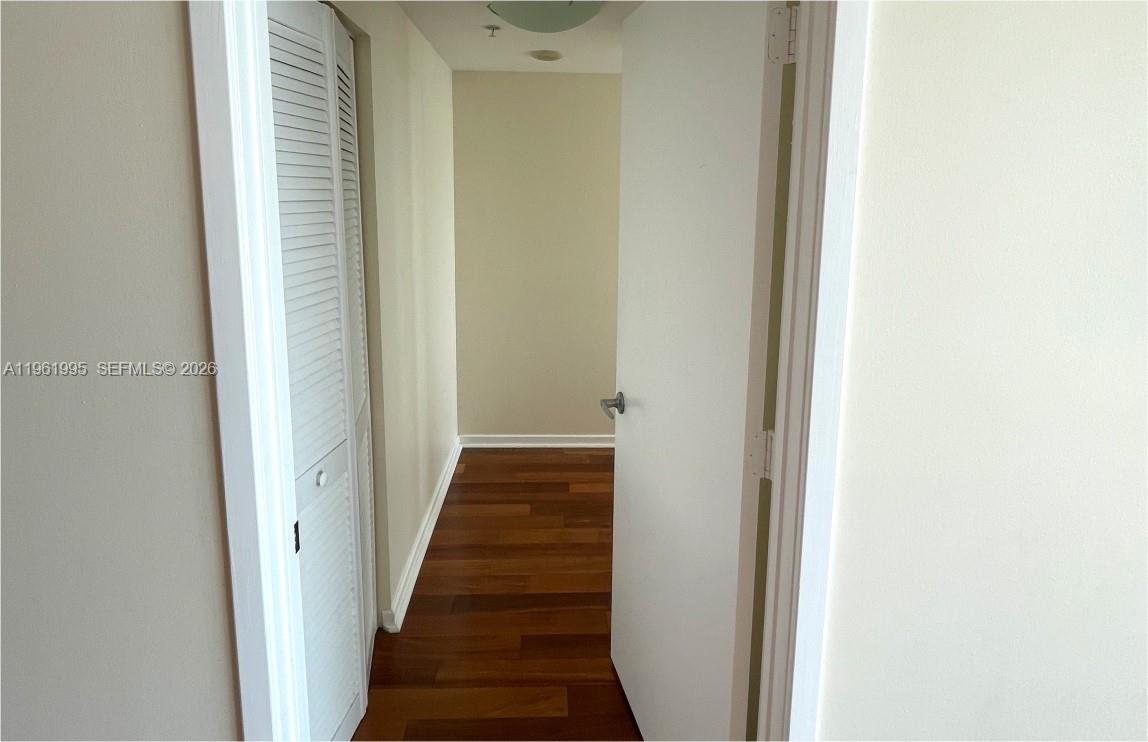 335 South Biscayne Boulevard, Unit 2212 Miami, FL 33131 - Photo 31 of 69 a view of a hallway with a wooden floor
