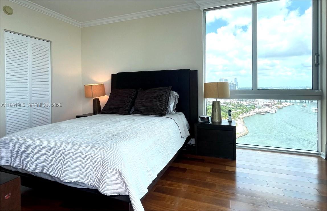 335 South Biscayne Boulevard, Unit 2212 Miami, FL 33131 - Photo 34 of 69 a bedroom with a bed and window