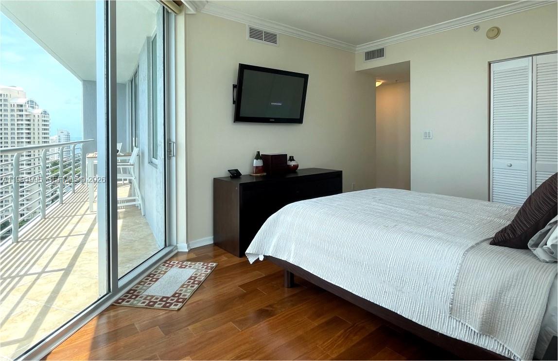 335 South Biscayne Boulevard, Unit 2212 Miami, FL 33131 - Photo 35 of 69 a bedroom with a bed and a flat screen tv