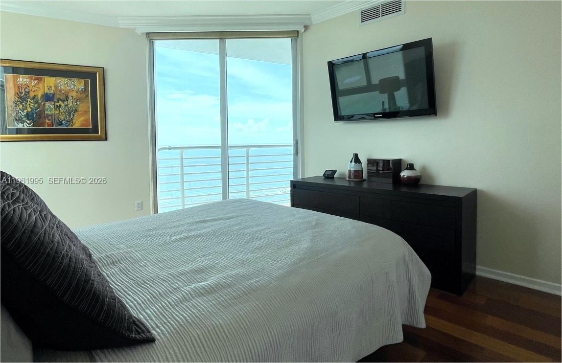 335 South Biscayne Boulevard, Unit 2212 Miami, FL 33131 - Photo 36 of 69 a bedroom with a bed and a flat screen tv