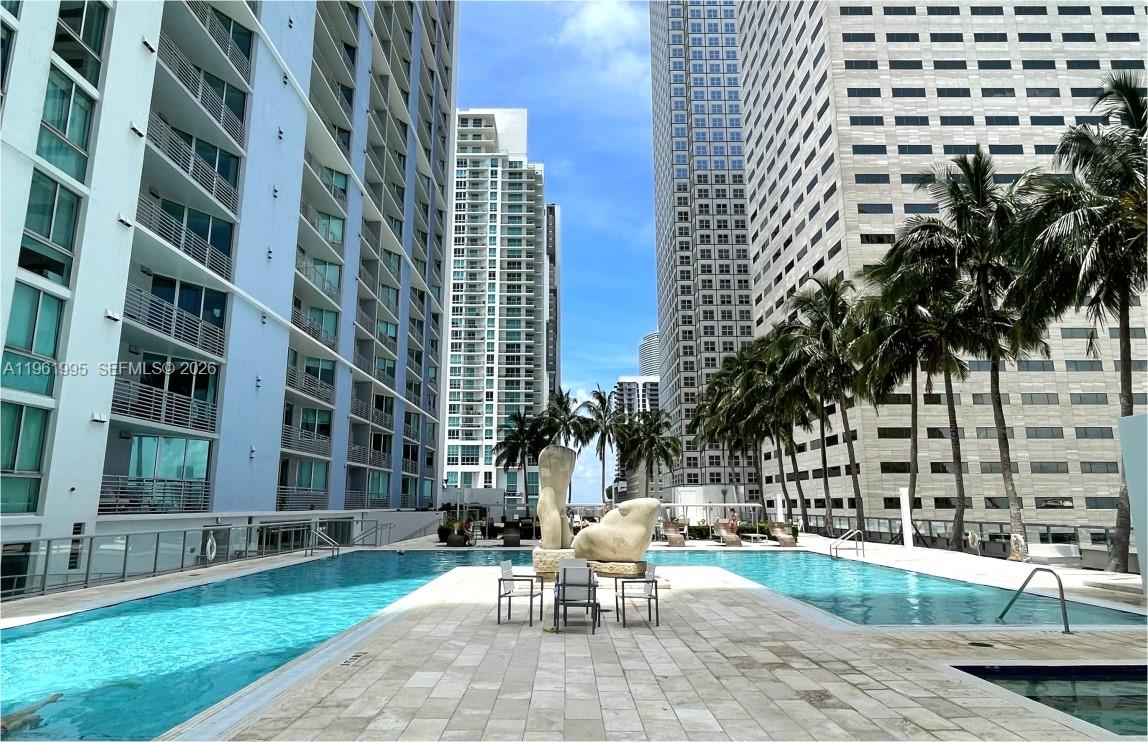 335 South Biscayne Boulevard, Unit 2212 Miami, FL 33131 - Photo 49 of 69 a view of a patio with a bench and chairs