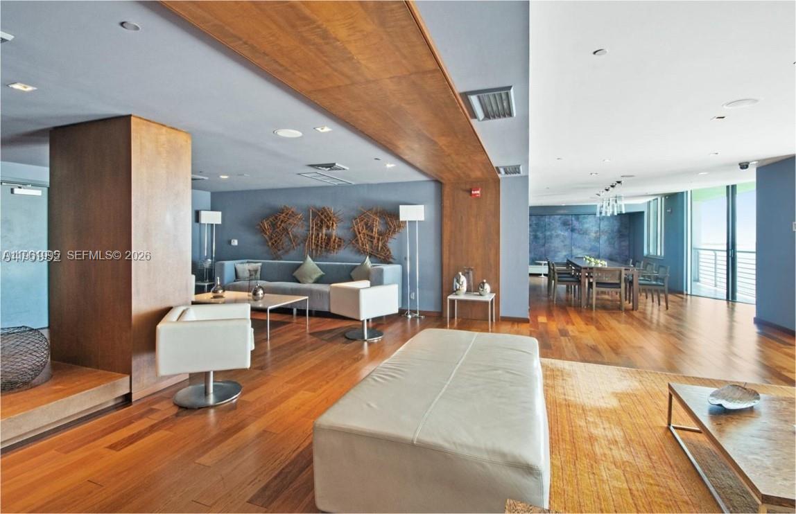 335 South Biscayne Boulevard, Unit 2212 Miami, FL 33131 - Photo 56 of 69 a living room with furniture and a table