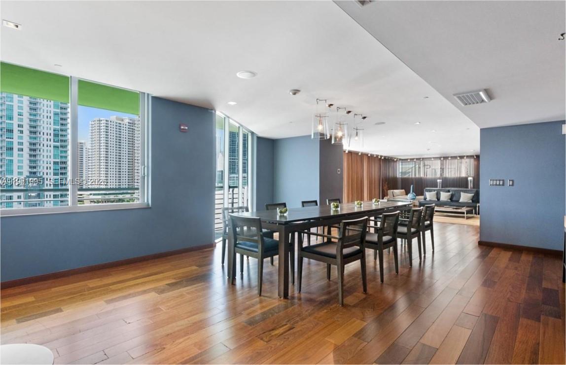 335 South Biscayne Boulevard, Unit 2212 Miami, FL 33131 - Photo 57 of 69 a view of a dining room with furniture window and wooden floor