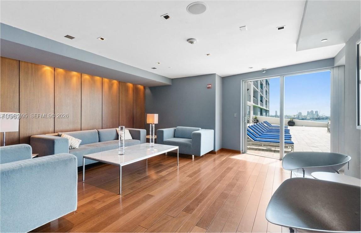 335 South Biscayne Boulevard, Unit 2212 Miami, FL 33131 - Photo 58 of 69 a living room with furniture and a large window