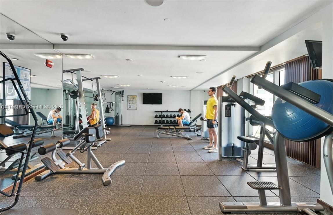 335 South Biscayne Boulevard, Unit 2212 Miami, FL 33131 - Photo 62 of 69 a view of a room with gym equipment
