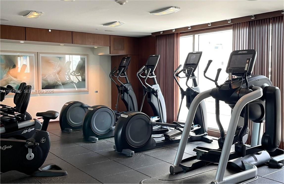 335 South Biscayne Boulevard, Unit 2212 Miami, FL 33131 - Photo 64 of 69 a view of a room with gym equipment