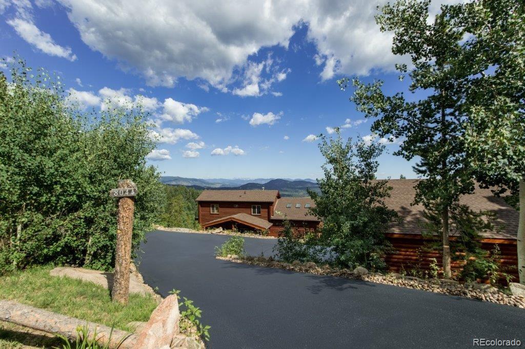 8044 Rossman Gulch Road Morrison, CO 80465 - Photo 15 of 34 a view of a street with a building in the background