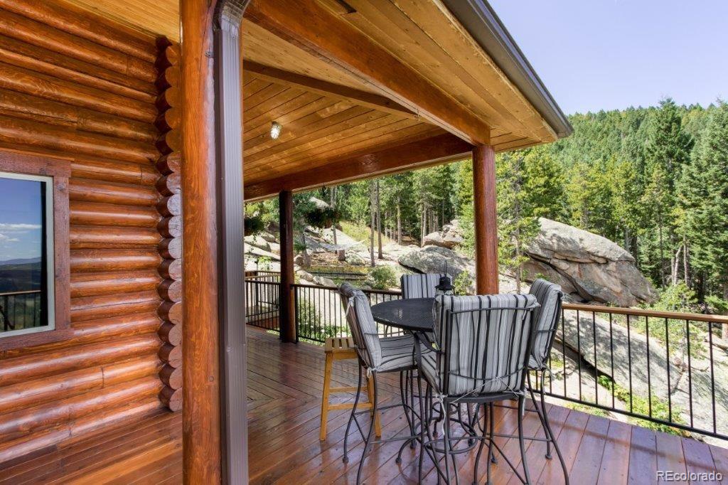 8044 Rossman Gulch Road Morrison, CO 80465 - Photo 25 of 34 a view of a chairs and table in the balcony