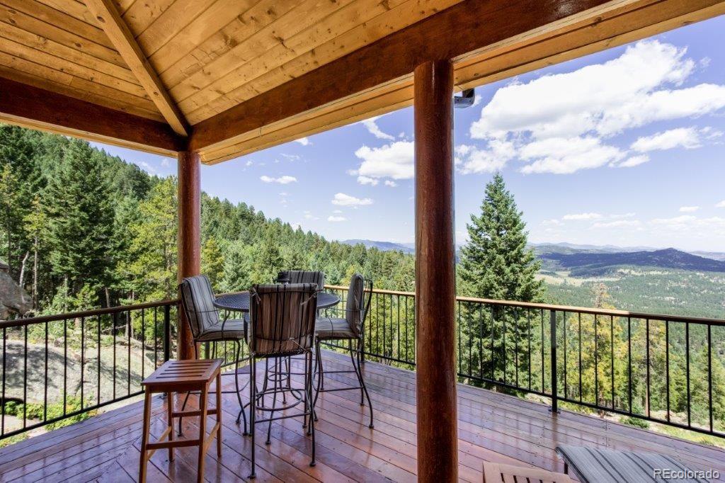 8044 Rossman Gulch Road Morrison, CO 80465 - Photo 26 of 34 a view of a chairs and table in the balcony