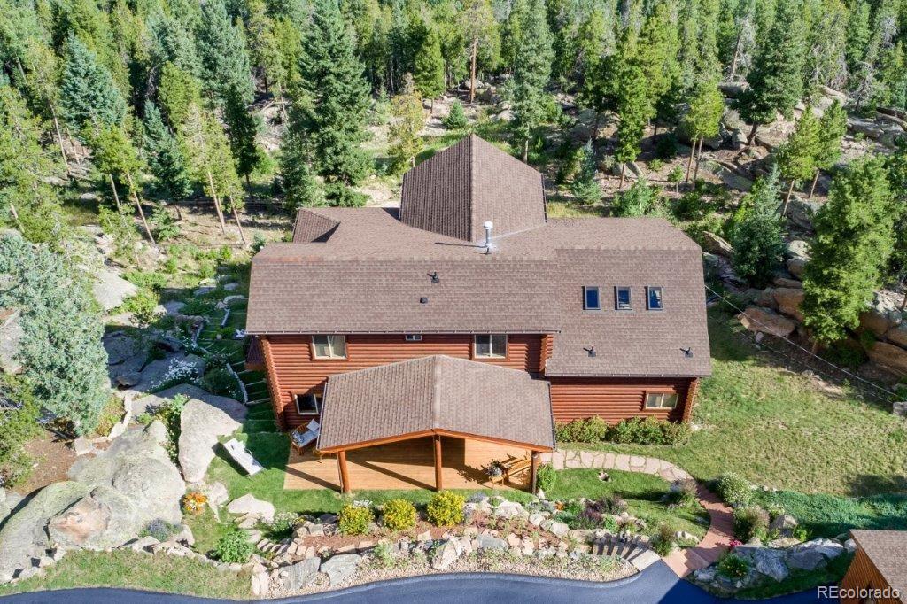 8044 Rossman Gulch Road Morrison, CO 80465 - Photo 4 of 34 an aerial view of a house with a garden