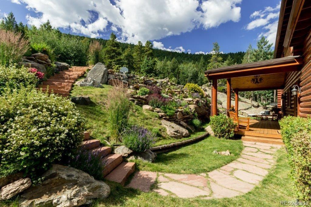 8044 Rossman Gulch Road Morrison, CO 80465 - Photo 8 of 34 a view of a yard with plants