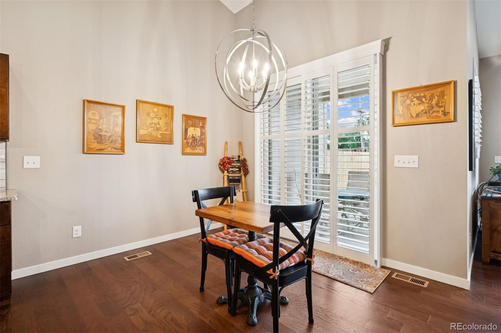 5795 Xenon Way Arvada, CO 80002 - Photo 17 of 33 a view of a livingroom with furniture and wooden floor