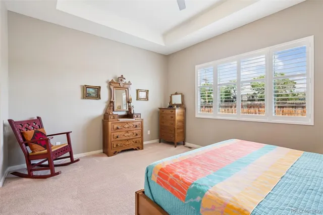 a bedroom with a bed and a chair