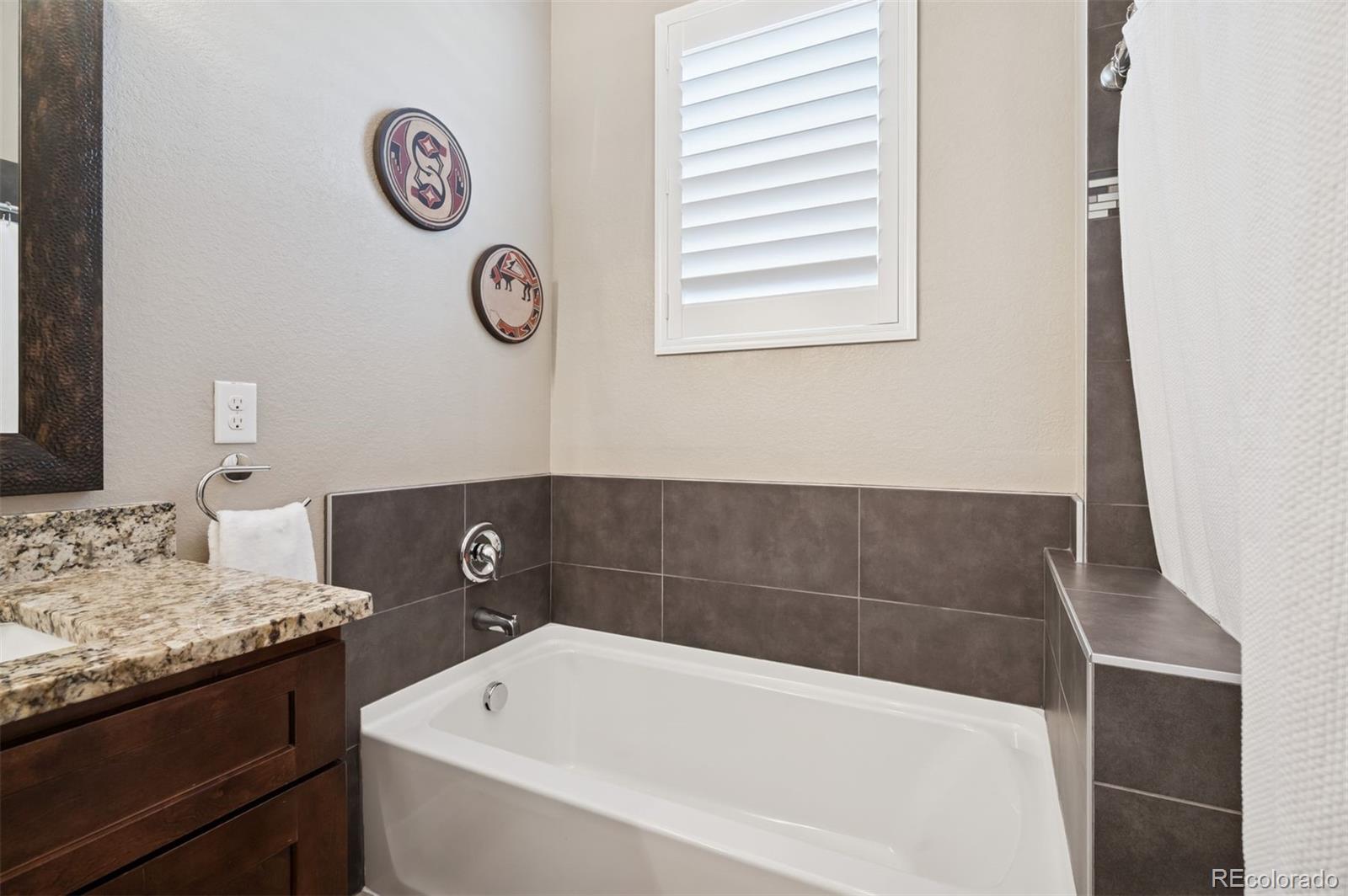 5795 Xenon Way Arvada, CO 80002 - Photo 21 of 33 a bathroom with a tub and a sink
