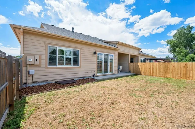 a house view with a backyard space